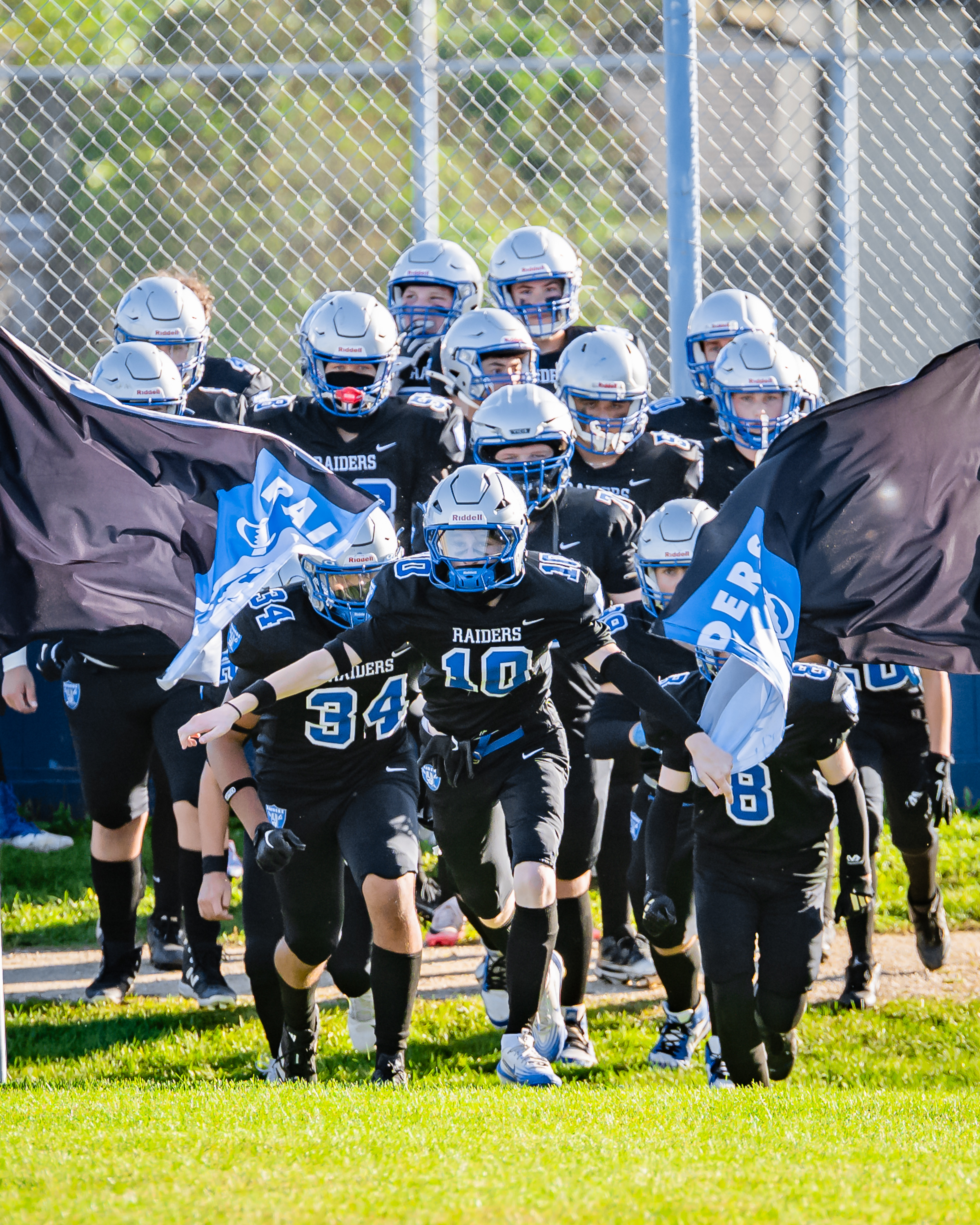 2025 JV Oak Park Raiders running on the field.